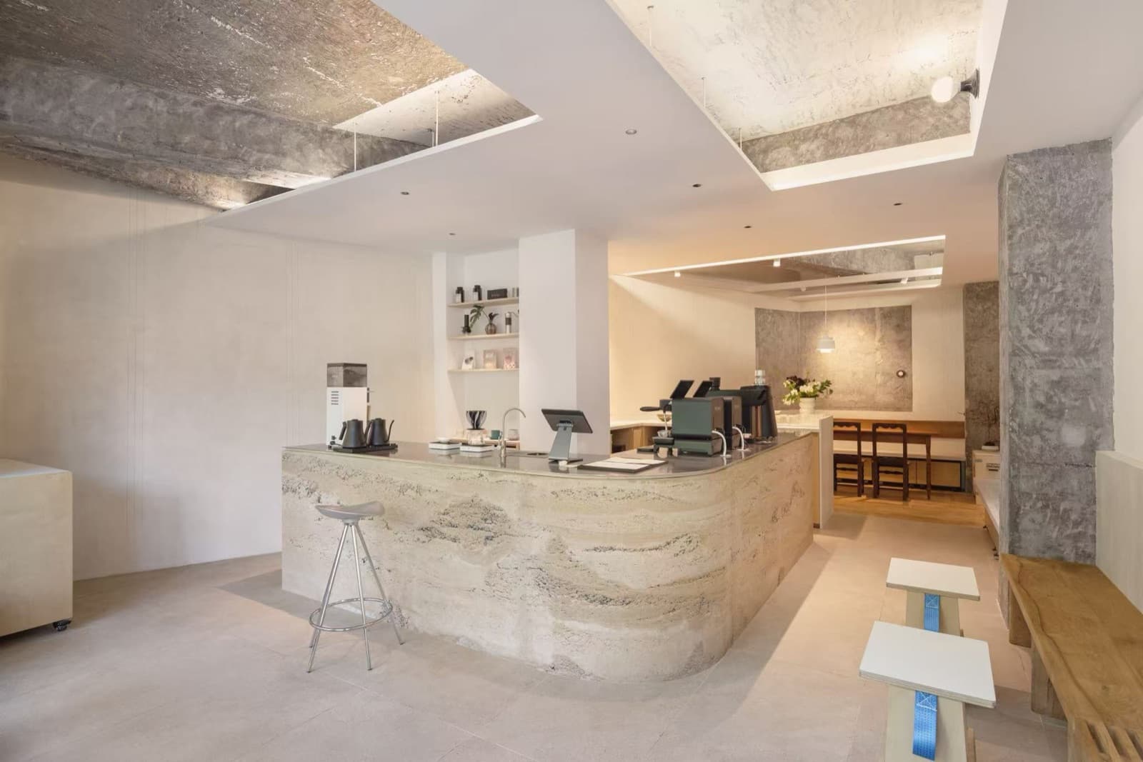 The whole bar at an angle, grinder and till on top, the bench and stools on castors on the right